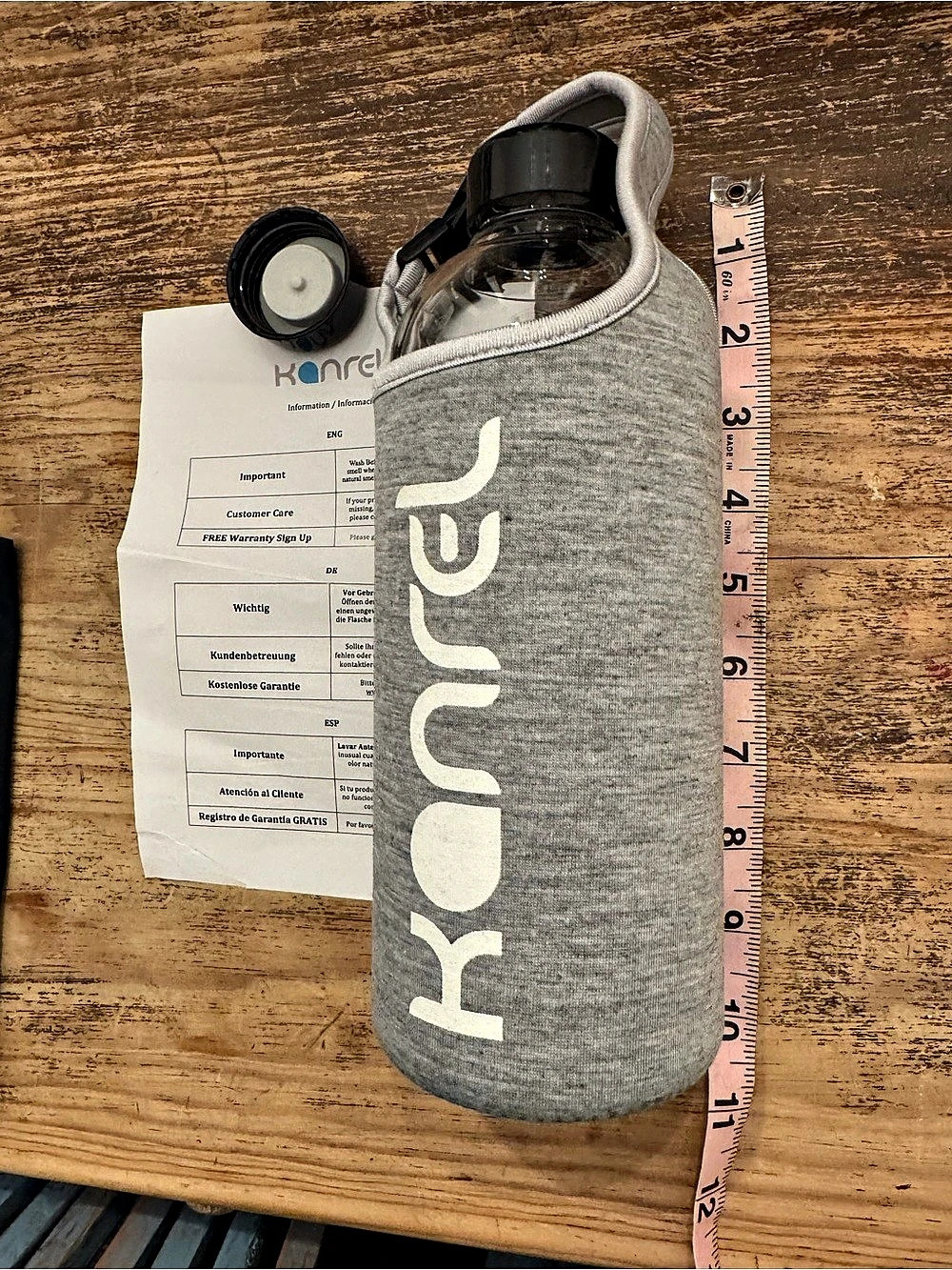 Kanrel Gray Insulated Water Bottle w/ gray sleeve and extra cap New, no box